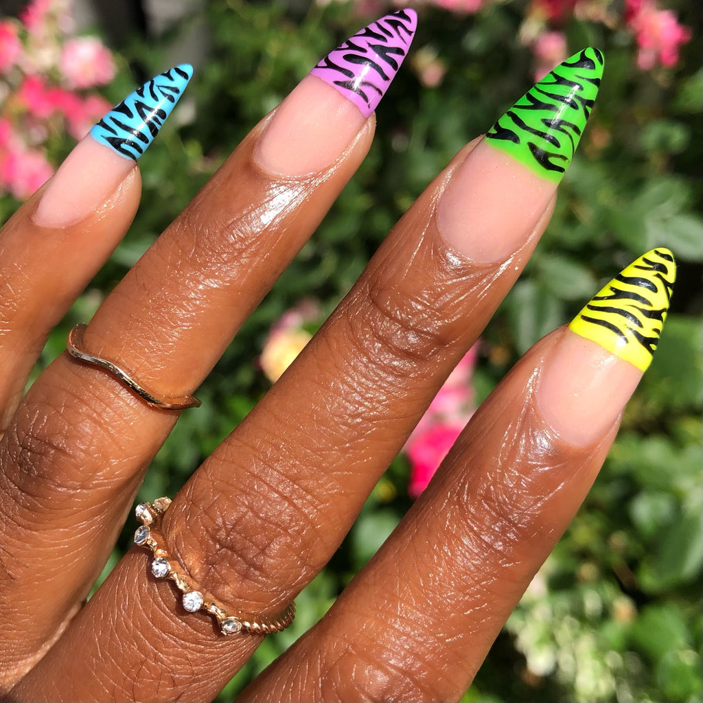 rainbow zebra nails with gel nail polish. Colours used are baby blue, lavender purple, bright green and neon lime.