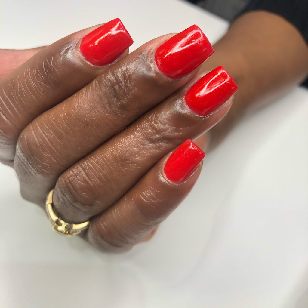 red shimmer gel polish on short square nails