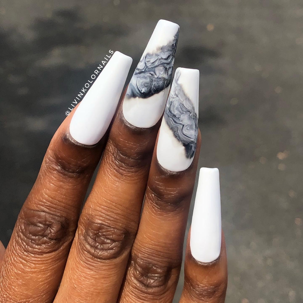 white gel polish on black woman