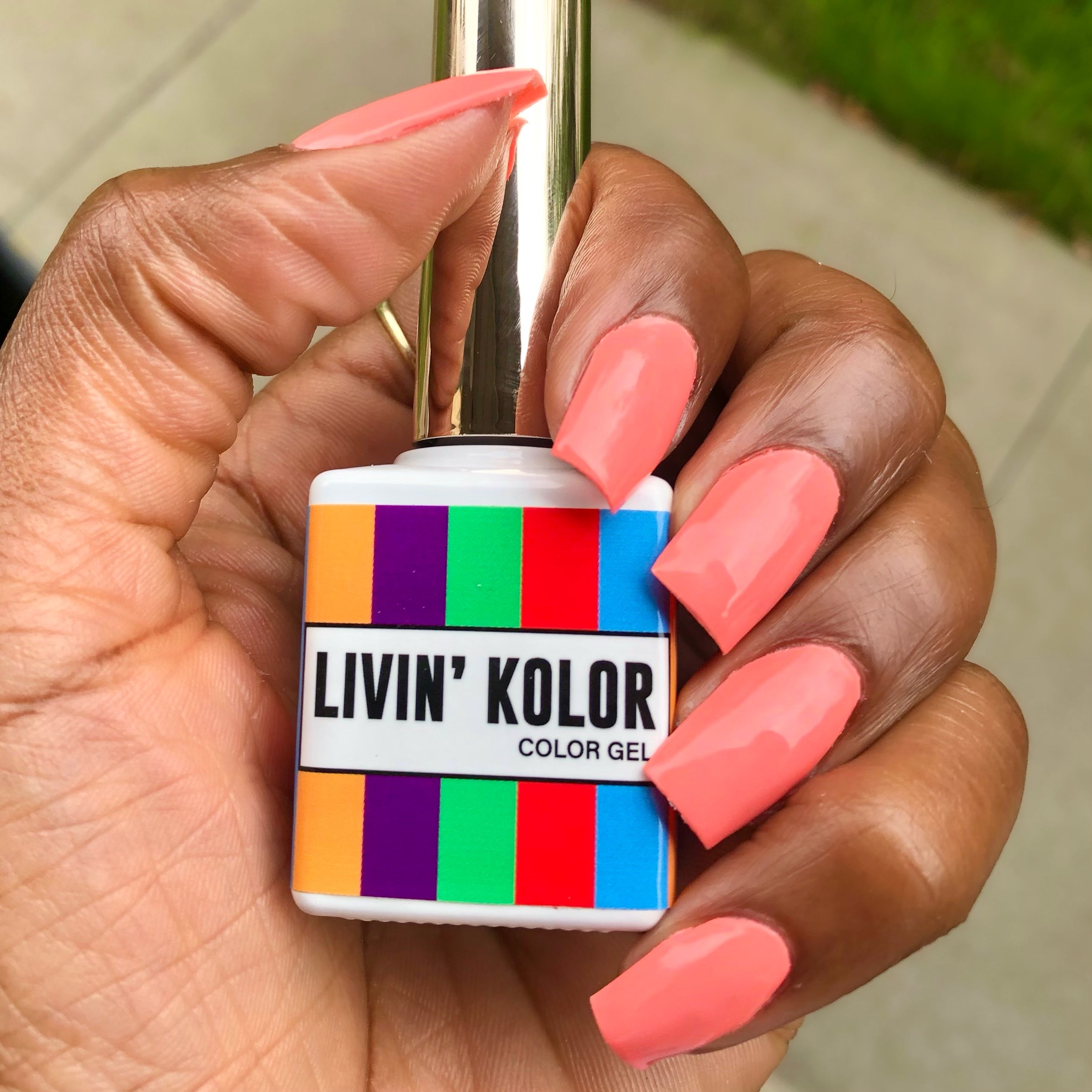 corel gel nail polish on natural nails. Black woman. square shaped nails.