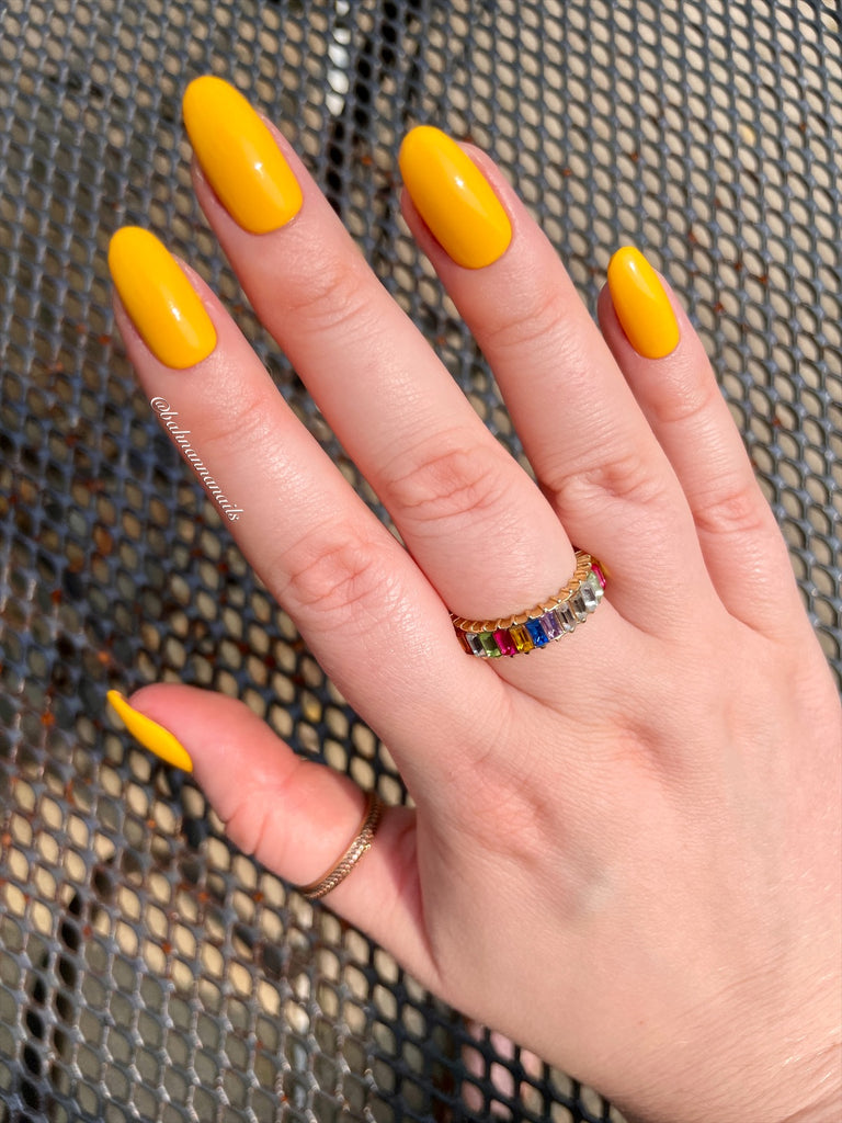 vibrant yellow gel nail polish on natural nails