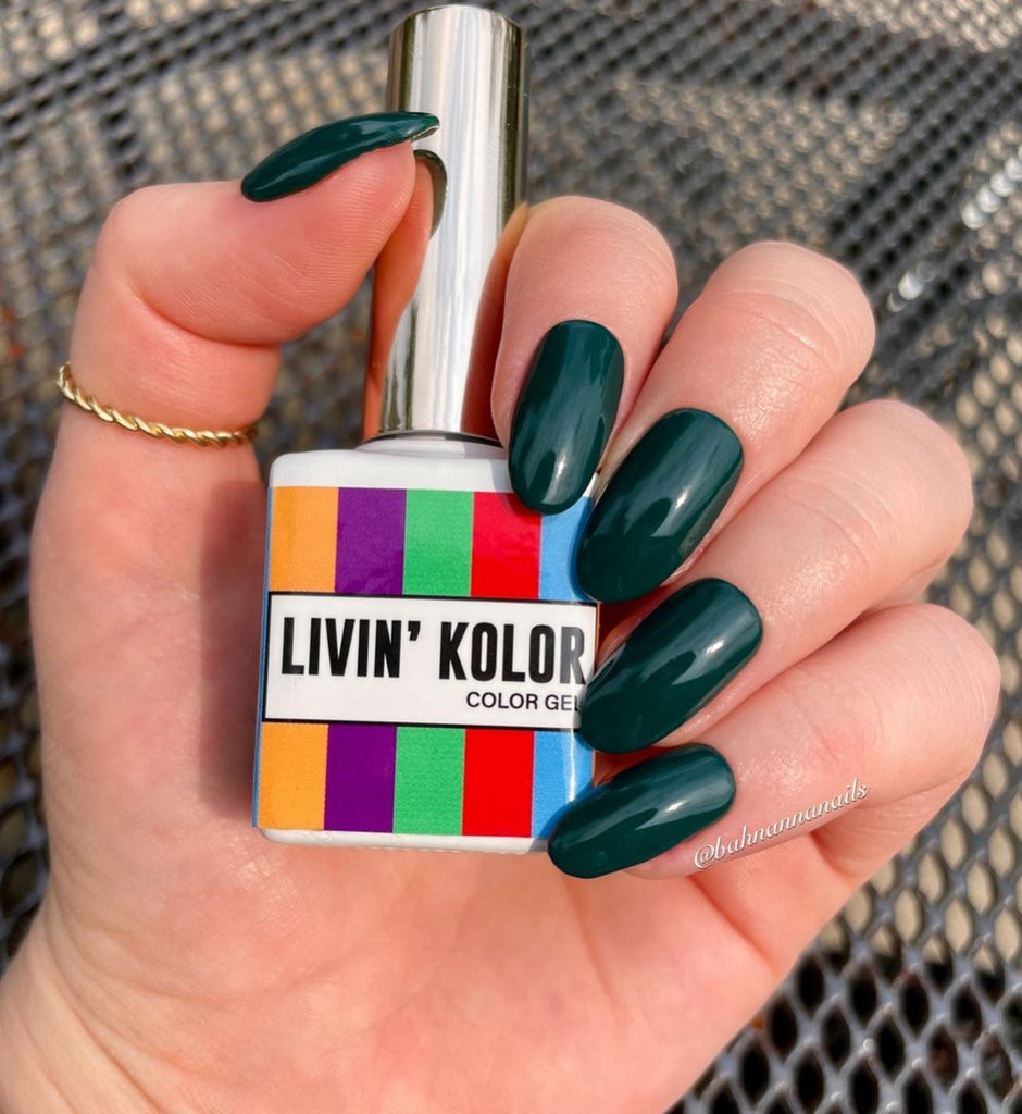 Dark emerald green gel polish on natural nails- oval shape