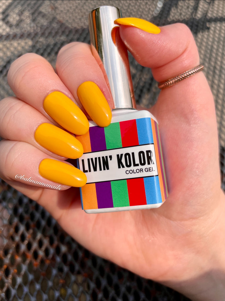 vibrant yellow gel nail polish on natural nails